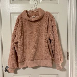 Pink mock neck Sherpa pullover.
